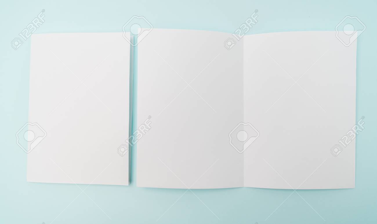bifold white template paper on blue background stock photo picture