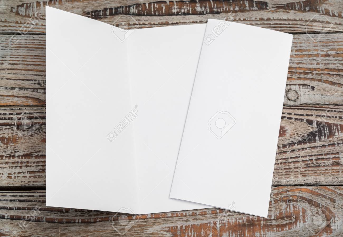 bifold white template paper on wood texture stock photo picture and