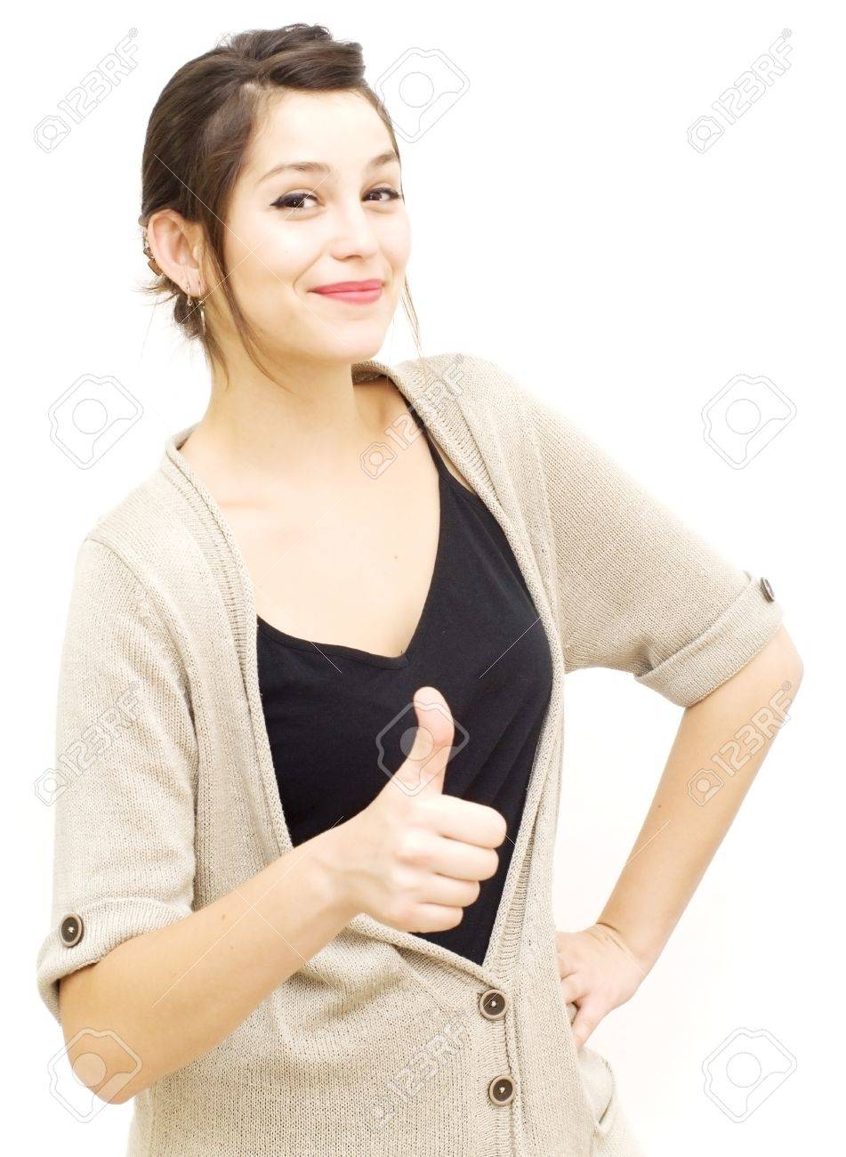 Portrait of a young woman with cardigan and her thumb up over white background - 20670777 Portrait of a young woman with cardigan and her thumb up over white background - 20670777