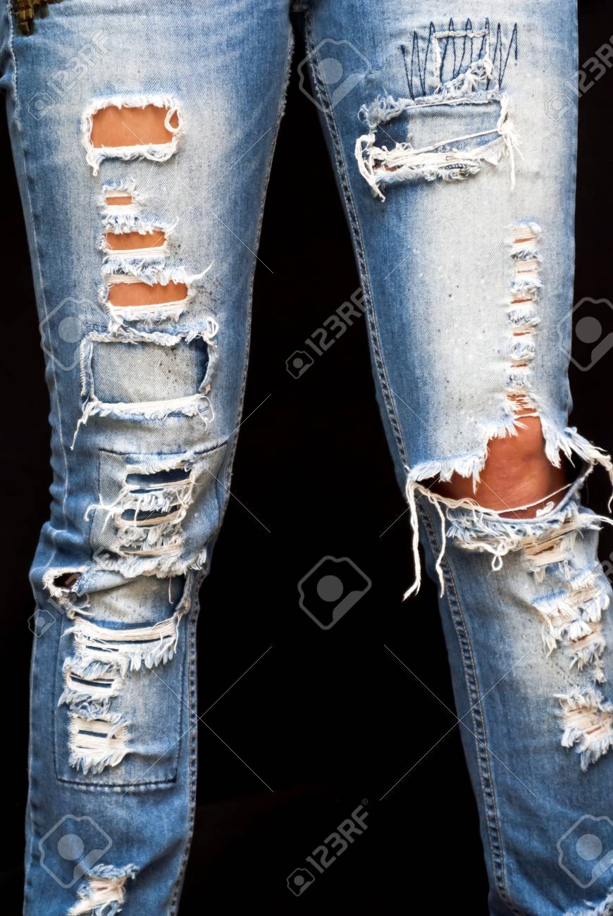 over ripped jeans
