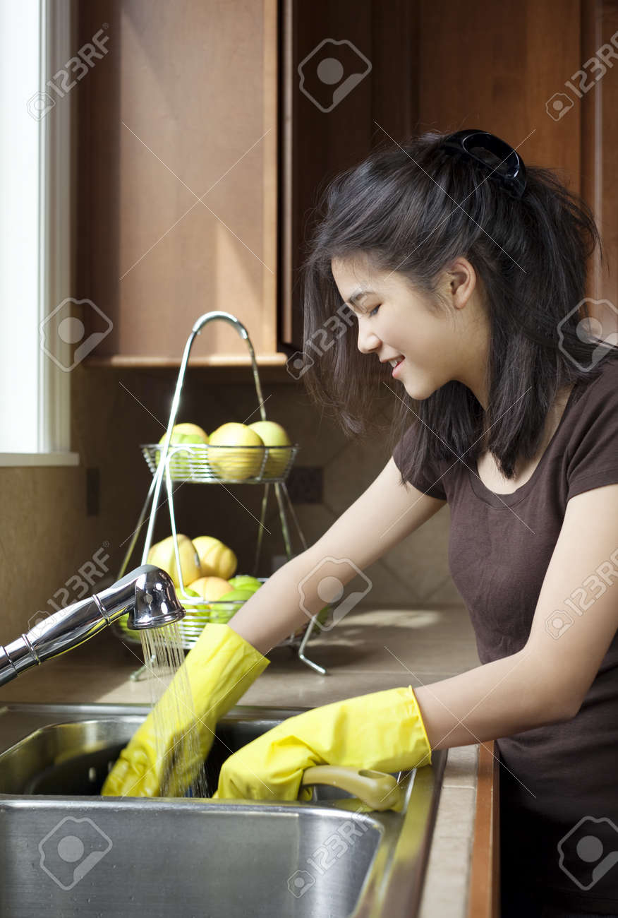 Kitchen Sink With Clean Dishes teen girl washing dishes at kitchen sink stock photo, picture and Kitchen Sink With Clean Dishes teen girl washing dishes at kitchen sink stock photo, picture and