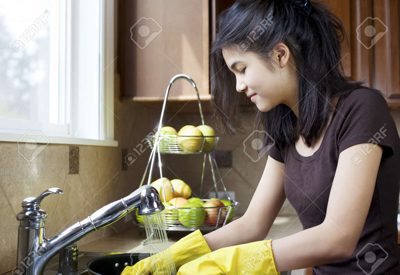 Kitchen Sink With Clean Dishes teen girl washing dishes at kitchen sink stock photo, picture and Kitchen Sink With Clean Dishes teen girl washing dishes at kitchen sink stock photo, picture and