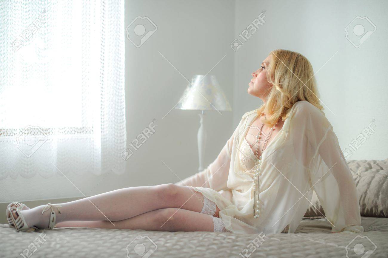 Mature Woman In Lingerie Posing In Bed
