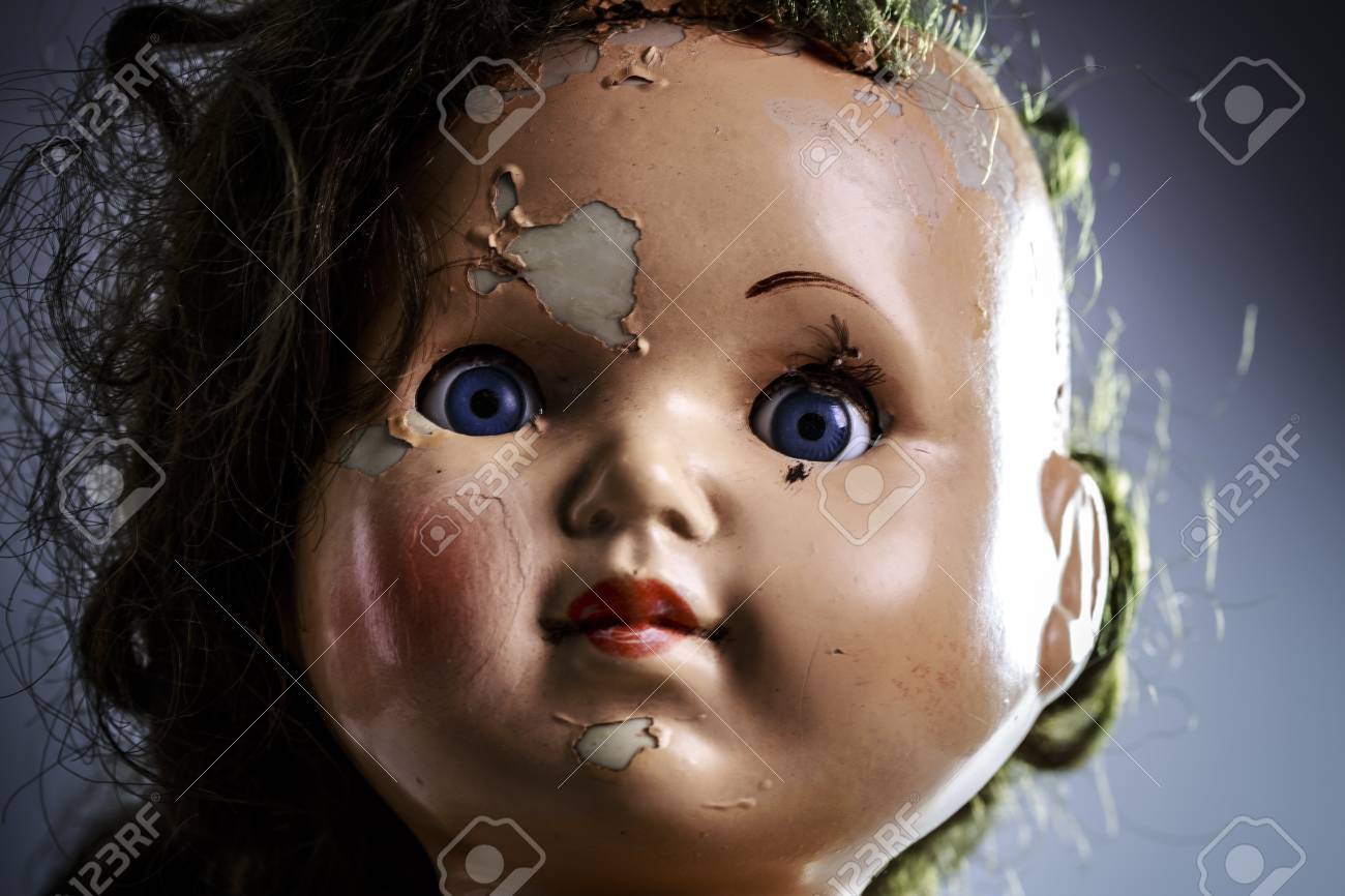 head of beatiful scary doll like from horror movie evil face