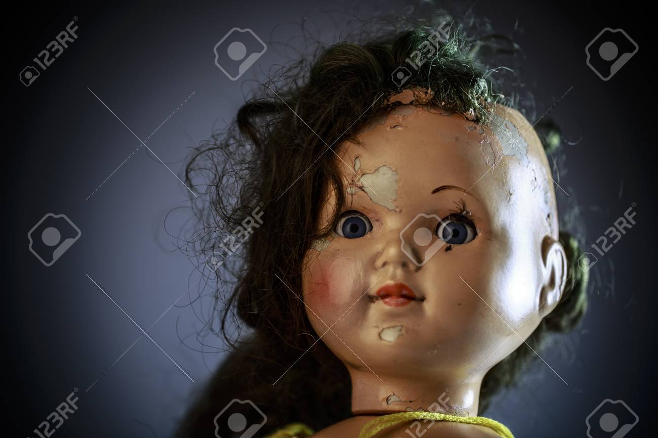 head of beatiful scary doll like from horror movie evil face