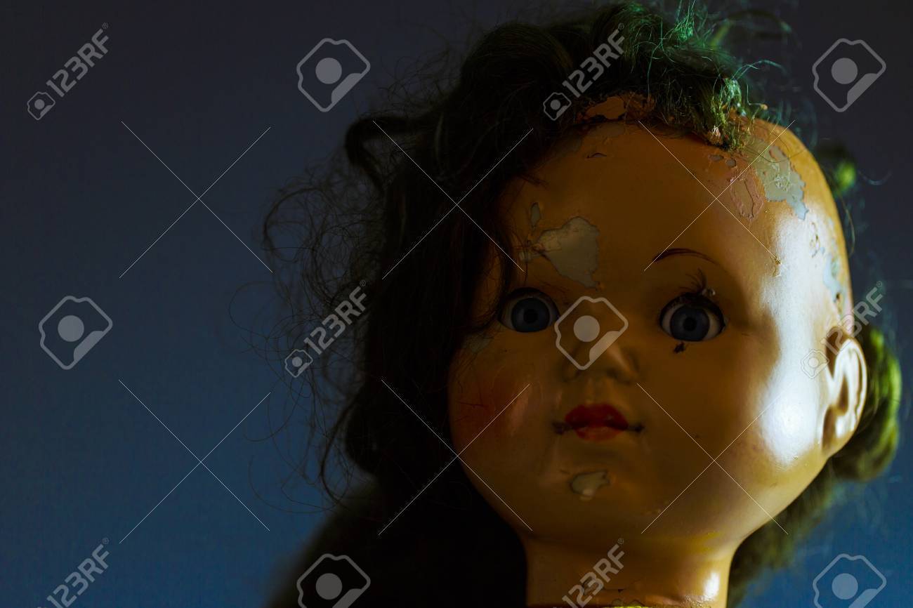head of beatiful scary doll like from horror movie evil face