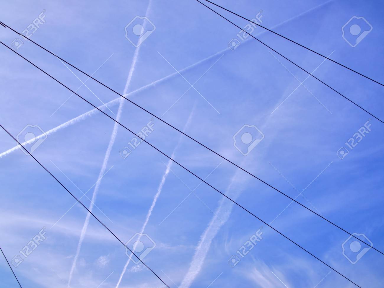 airplane contrails on blue