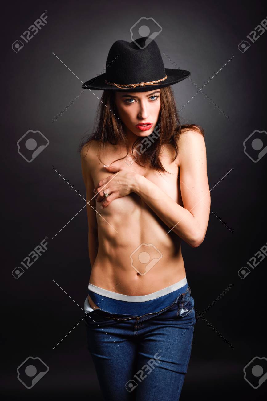 Topless Woman Wearing Blue Jeans, Panties And Hat On Black Background  Фотография, картинки, изображения и сток-фотография без роялти. Image  55150642