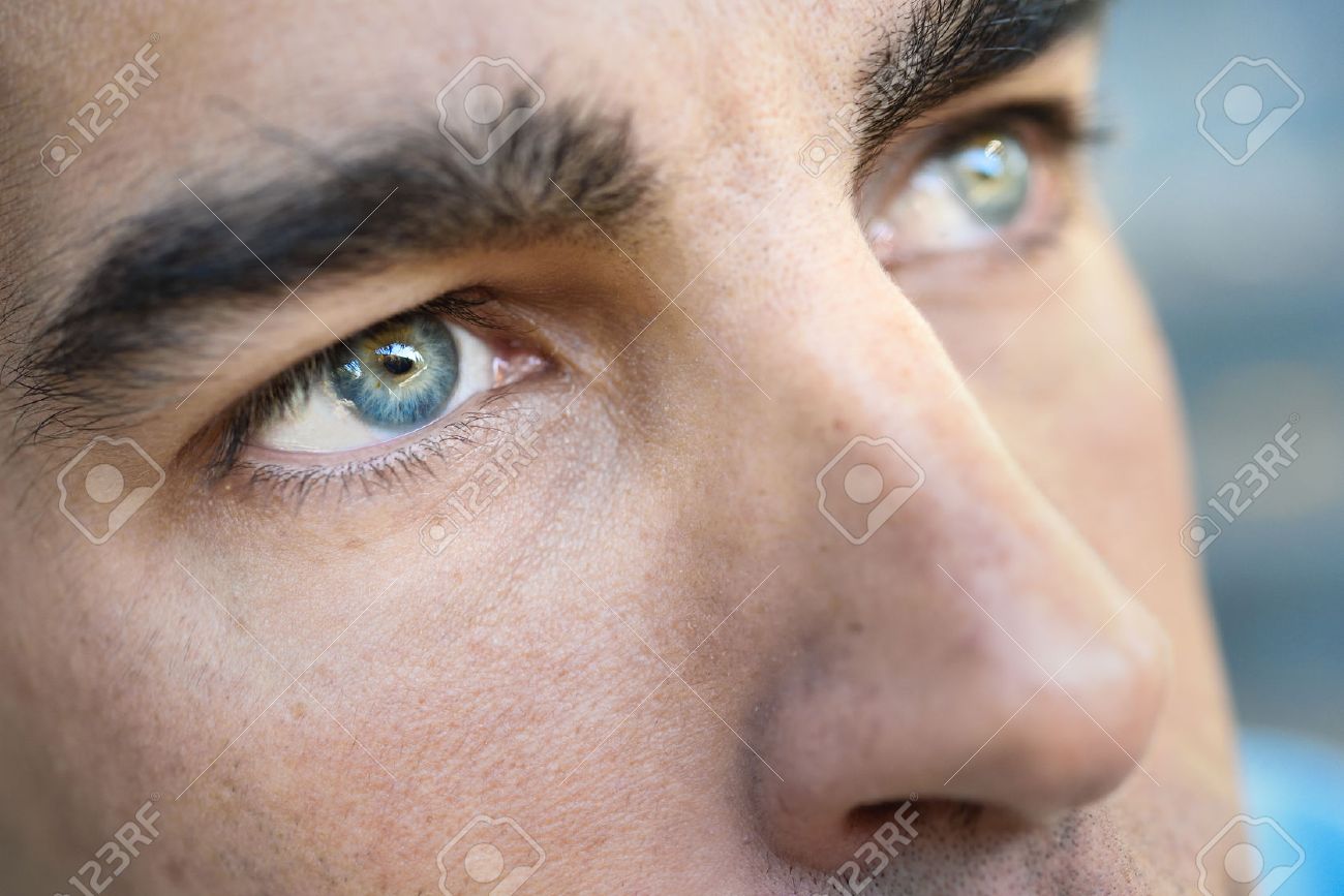 Close-up Shot Of Man's Eye. Man With Blue Eyes. Stock Photo