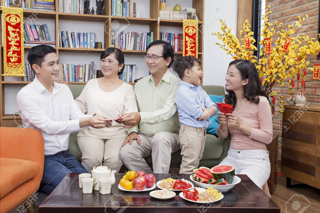 Vietnamese Family Celebrate Lunar New Year Stock Photo Picture And Royalty Free Image Image