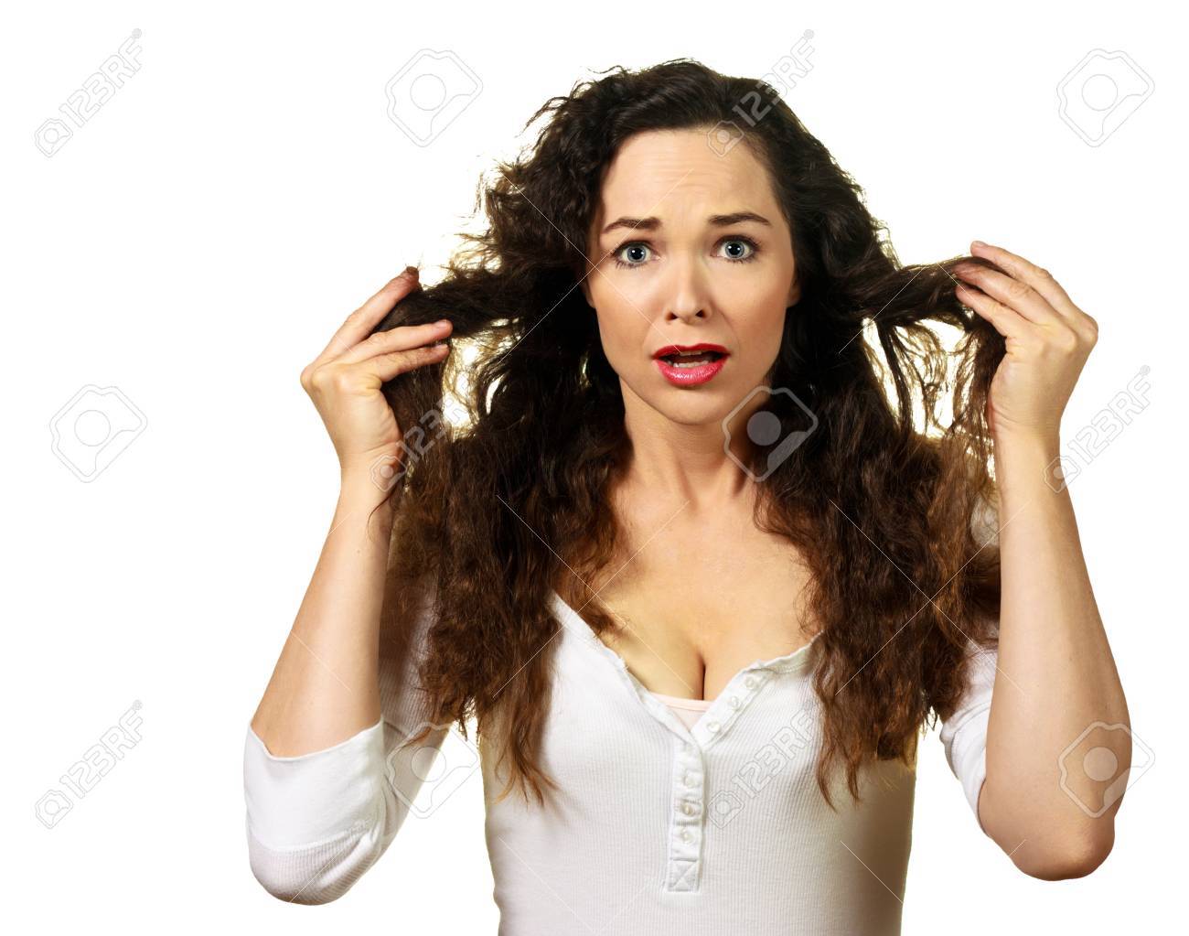 Isolated portrait of a beautiful young woman having a bad hair day - 9255136 Isolated portrait of a beautiful young woman having a bad hair day - 9255136