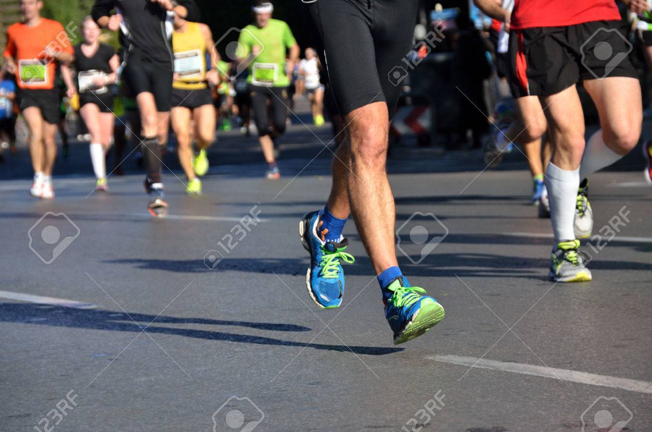 Marathon running race, people feet on road, sport, fitness and healthy lifestyle concept - 24263879 Marathon running race, people feet on road, sport, fitness and healthy lifestyle concept - 24263879