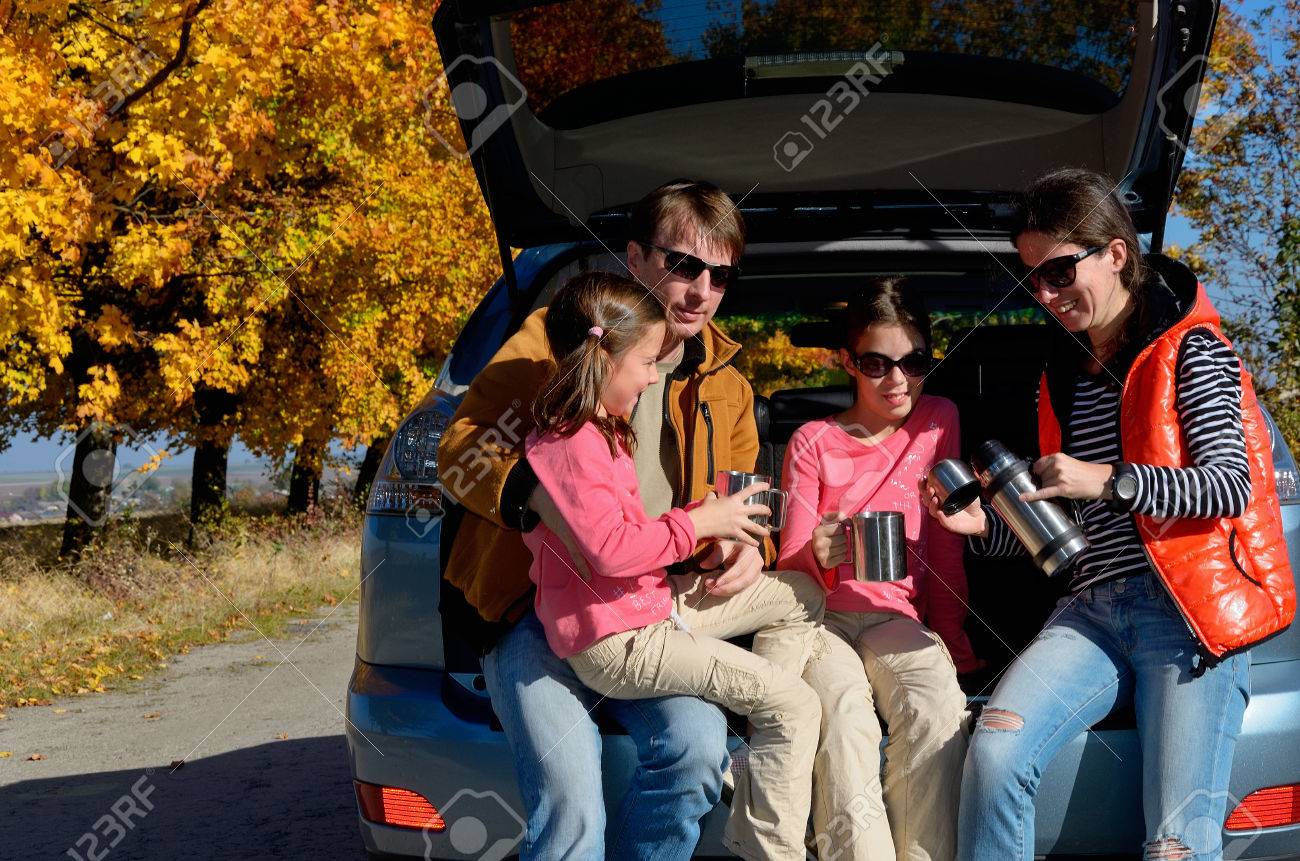 Car trip on autumn family vacation, happy parents and kids travel and have fun, car insurance concept - 32644717 Car trip on autumn family vacation, happy parents and kids travel and have fun, car insurance concept - 32644717