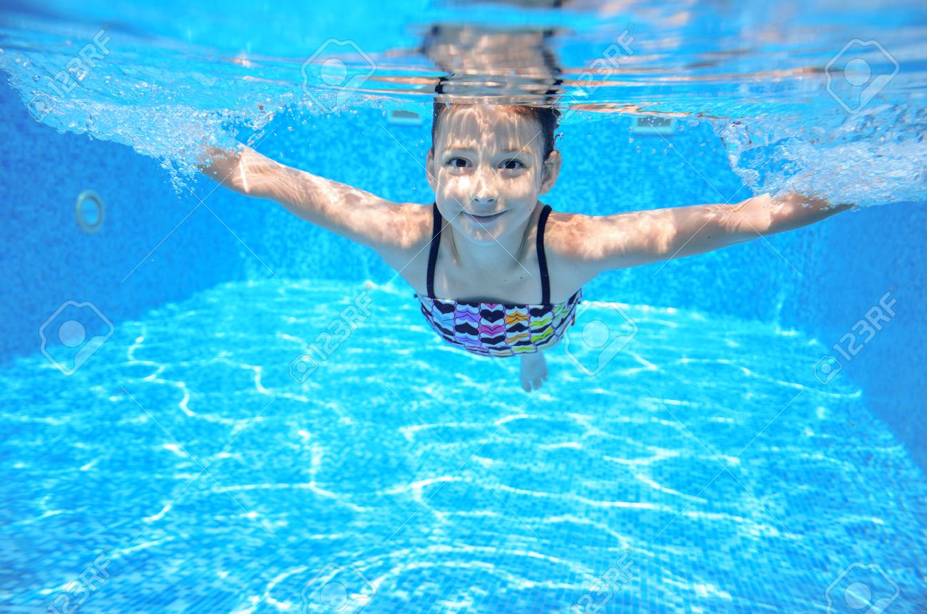 Happy active underwater child swims in pool, beautiful healthy girl swimming and having fun on family summer vacation, kids sport - 33873208 Happy active underwater child swims in pool, beautiful healthy girl swimming and having fun on family summer vacation, kids sport - 33873208