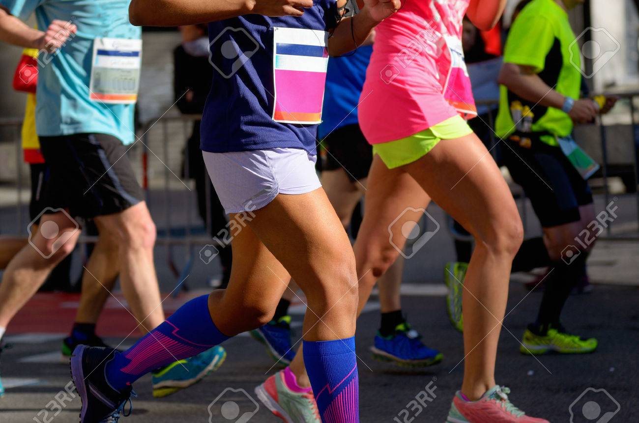 Marathon running race, people feet on road, women run, sport, fitness and healthy lifestyle concept - 38189658 Marathon running race, people feet on road, women run, sport, fitness and healthy lifestyle concept - 38189658