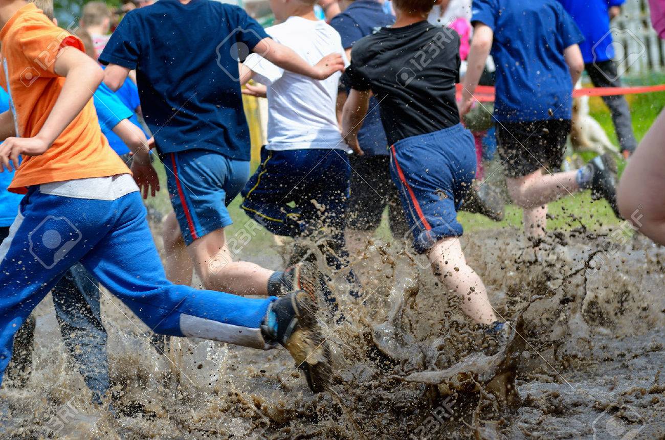 Kids running trail race legs in mud and water - 41248898 Kids running trail race legs in mud and water - 41248898