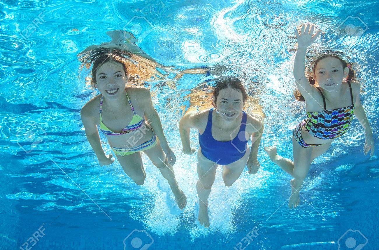 Family swim in pool or sea underwater, happy active mother and children have fun in water, kids sport on family vacation - 45148752 Family swim in pool or sea underwater, happy active mother and children have fun in water, kids sport on family vacation - 45148752