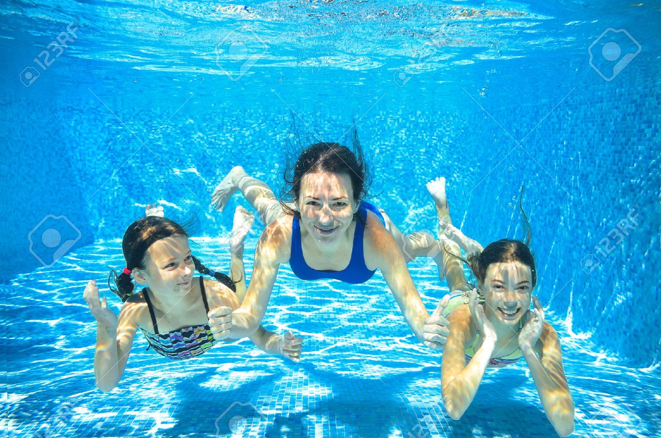Family swim in pool underwater, happy active mother and children have fun under water, kids sport on family vacation - 50939382 Family swim in pool underwater, happy active mother and children have fun under water, kids sport on family vacation - 50939382