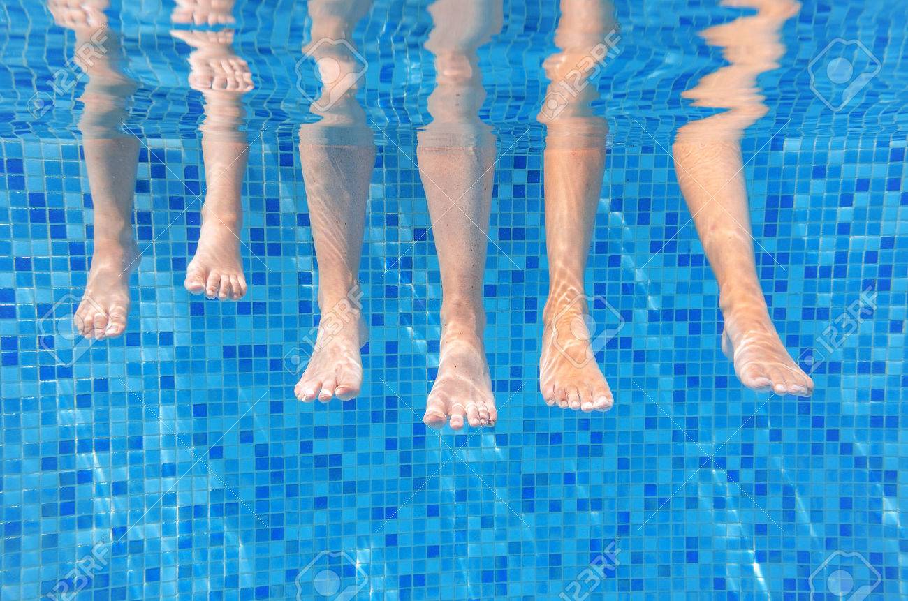 Funny underwater family legs in swimming pool, under water view of mother and kids, vacation and sport concept - 54409630 Funny underwater family legs in swimming pool, under water view of mother and kids, vacation and sport concept - 54409630