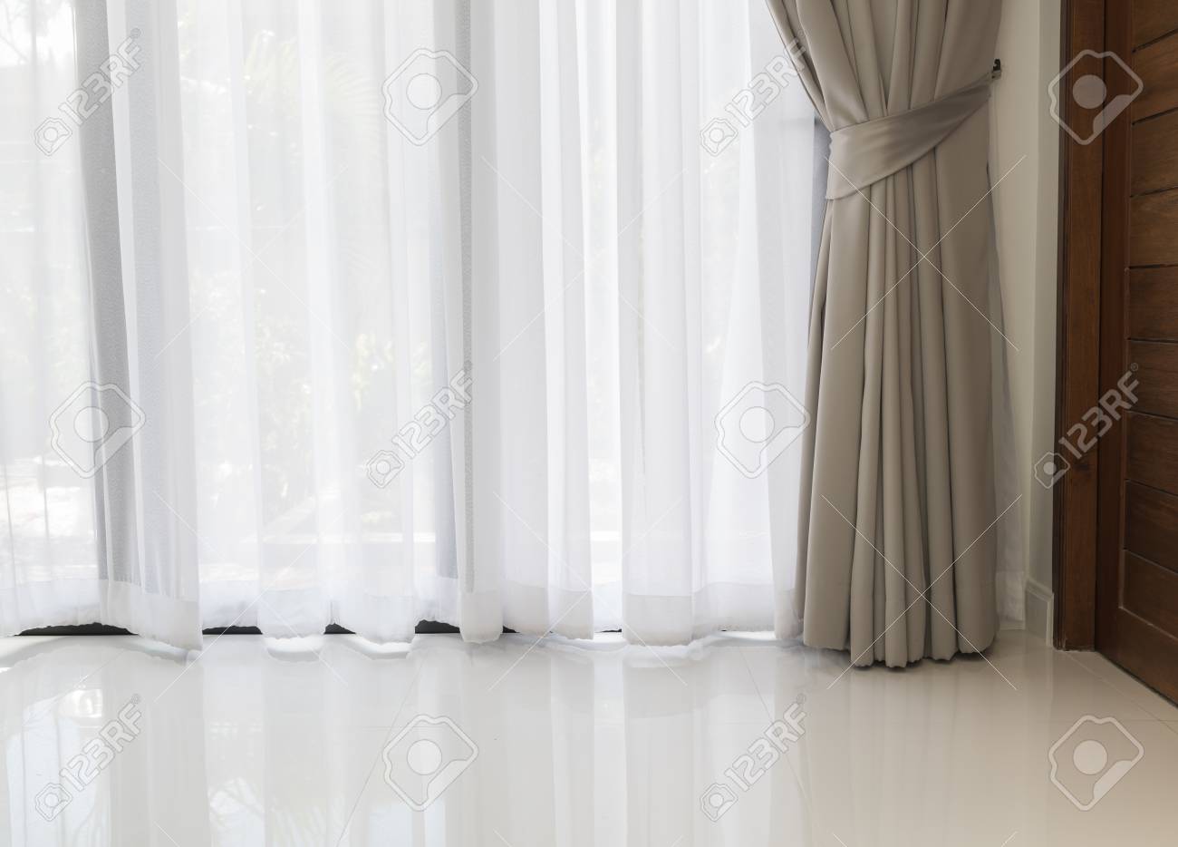 Modern Living Room With Soft White And Grey Curtain Background Stock Photo