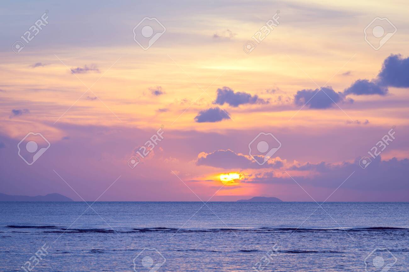 Beautiful Beach Sunset With Blue Sea And Golden Light Sky Cloud ...