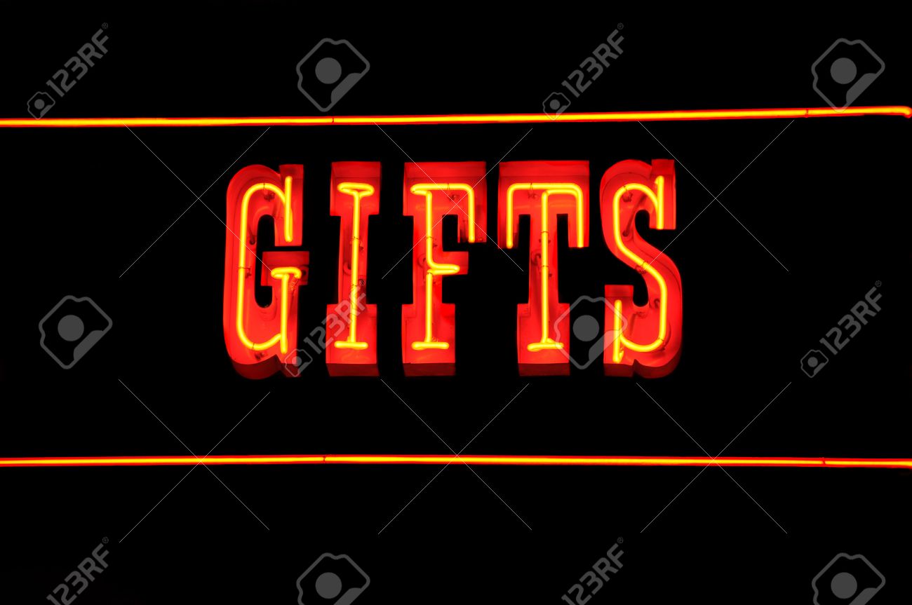 neon sign with the word gifts over black stock photo picture and