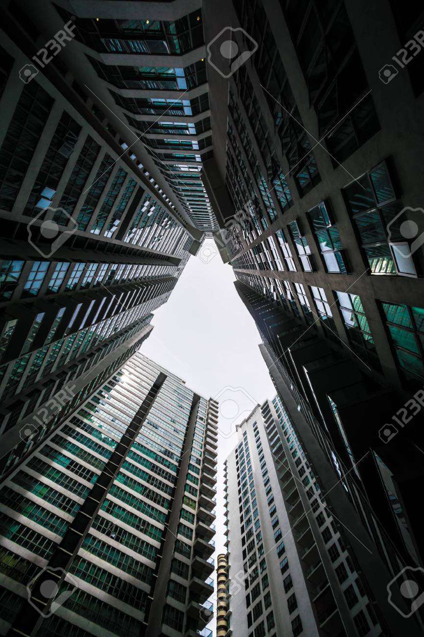 Low Angle Shot Of Modern Glass City Buildings With Clear Sky