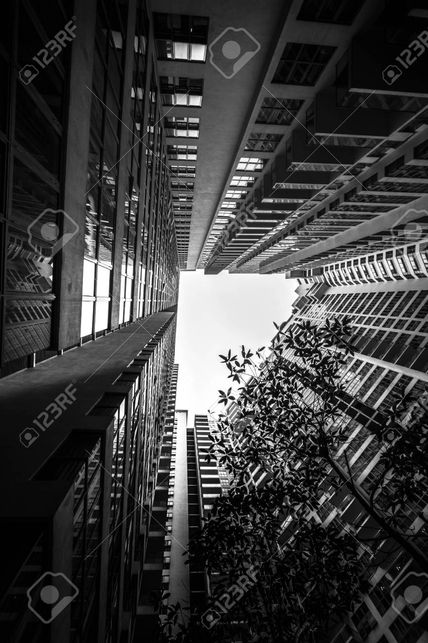 Low Angle Shot Of Modern Glass City Buildings With Clear Sky