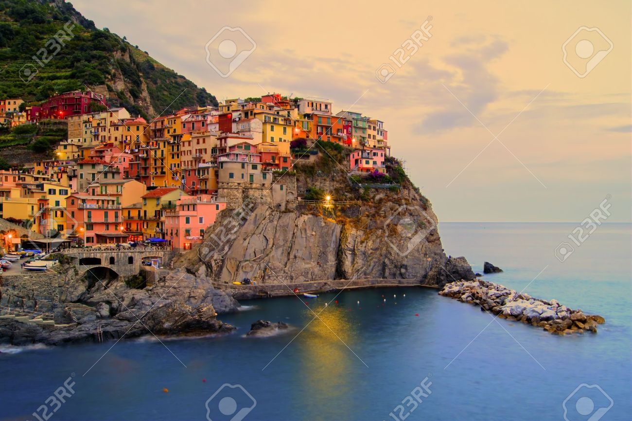Village of Manarola, Italy on the Cinque Terre coast at sunset - 13293982 Village of Manarola, Italy on the Cinque Terre coast at sunset - 13293982