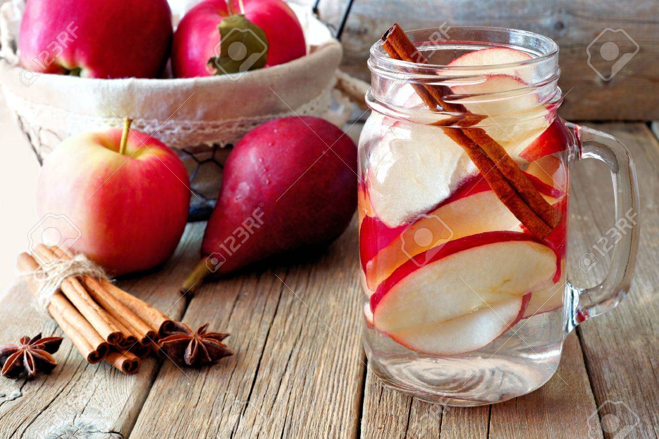 Autumn Themed Detox Water With Apple Cinnamon And Red Pear In Stock Photo Picture And Royalty Free Image Image 62560614