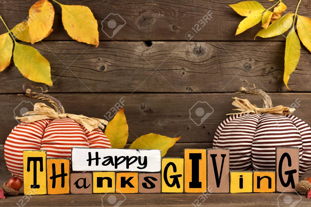 Happy Thanksgiving Wood Sign With Cloth Pumpkins And Leaves Against A Rustic Wooden Background Stock Photo Picture And Royalty Free Image Image 87237797