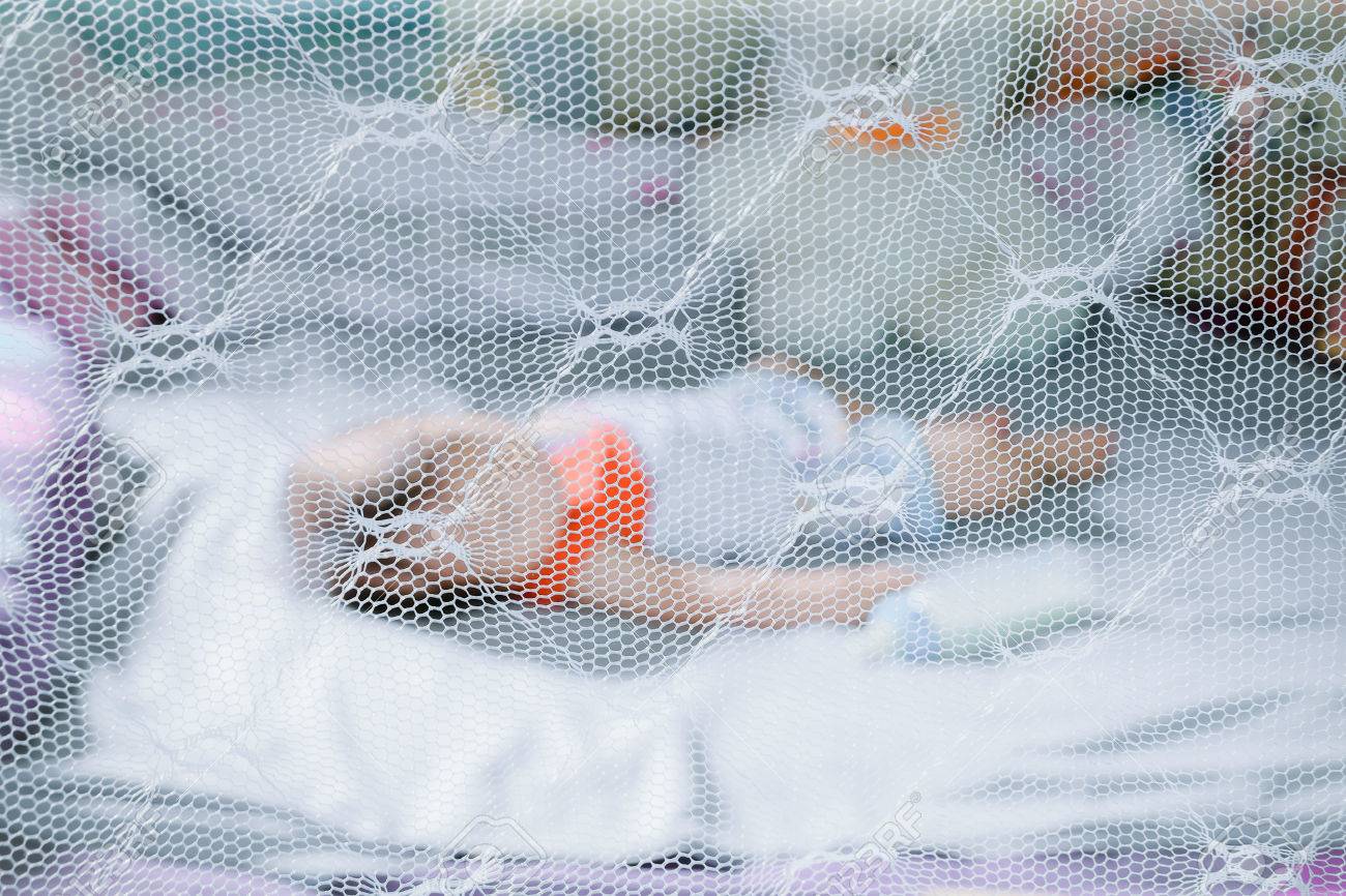 Child Sleeping Under Mosquito Net ,provides Mosquito Nets To 