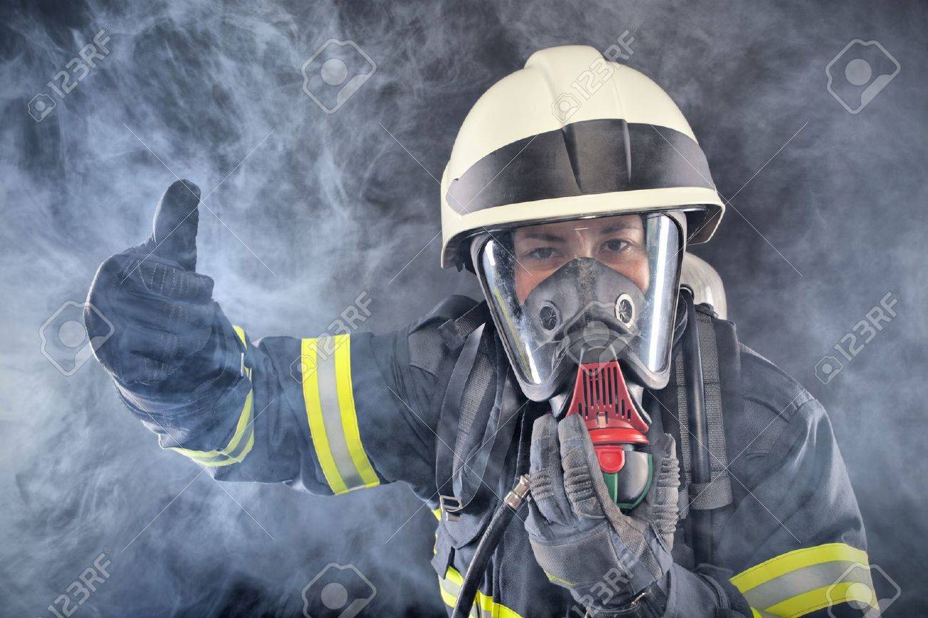 Firewoman in fire protection suit and mask - 19588394 Firewoman in fire protection suit and mask - 19588394