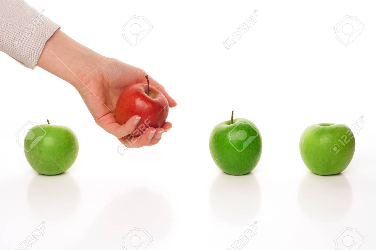 Picking different apple among other similar on white - 61448094 Picking different apple among other similar on white - 61448094