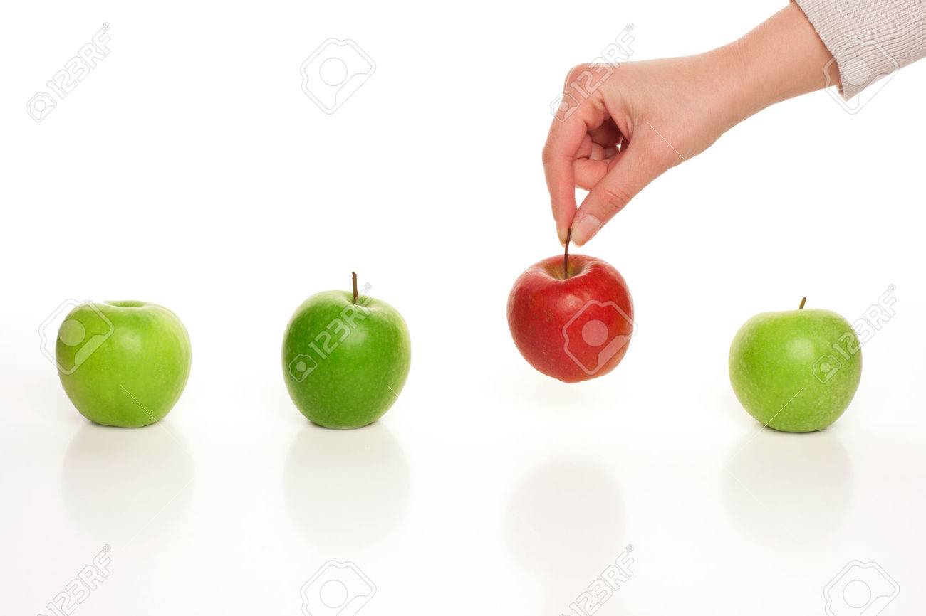 Picking different apple among similar on white - 61448971 Picking different apple among similar on white - 61448971