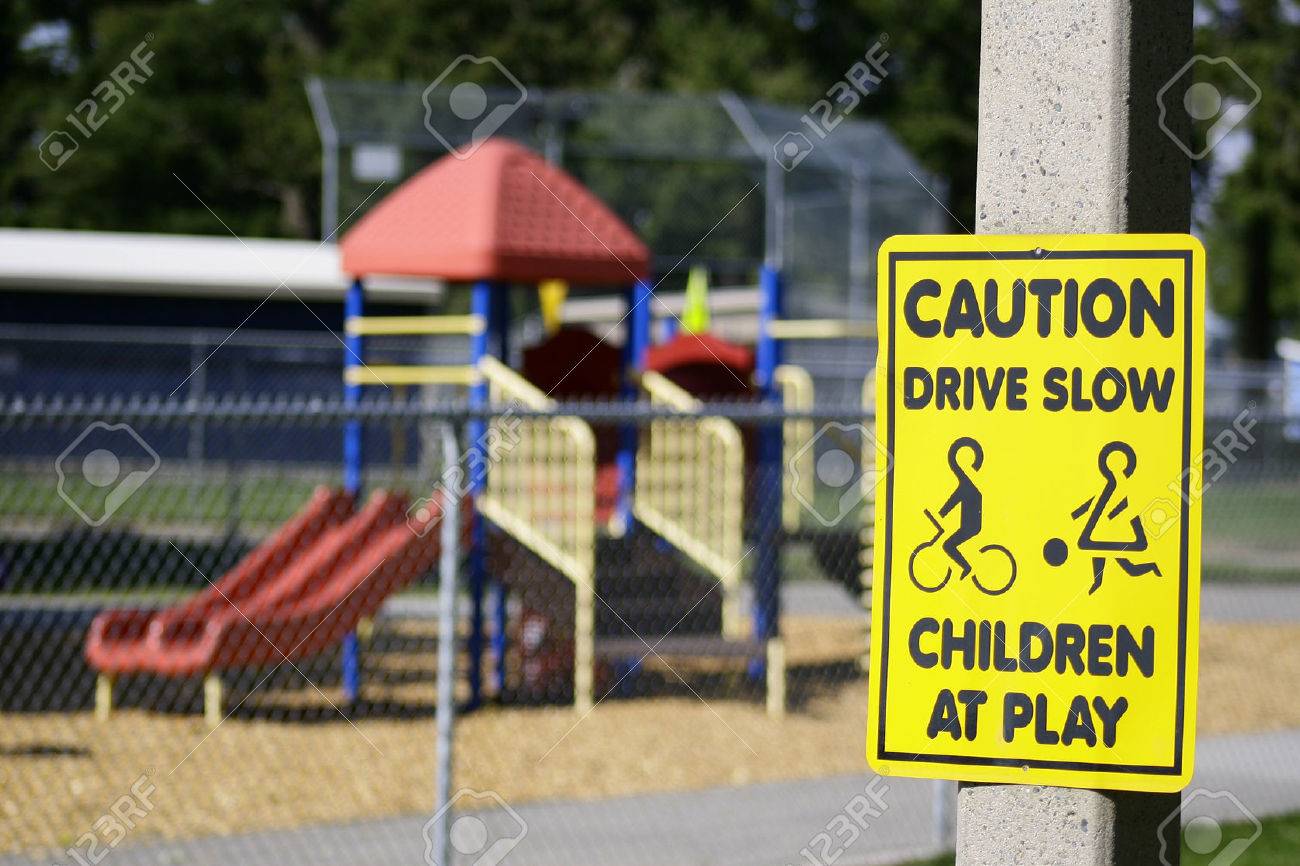 Horizontal Photo Of A Caution Drive Slow Children Playground Stock Photo Picture And Royalty Free Image Image 34596642