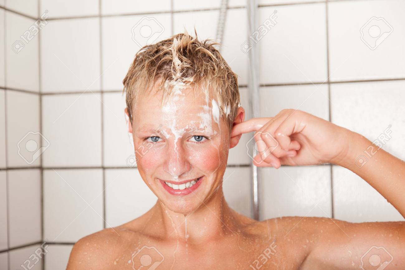 Young boys shower Young Boy With A Gorgeous Friendly Smile Taking A Shower Standing Under The  Running Water With His Hand To His Ear, Close Up Head And Shoulders Stock  Photo, Picture and Royalty Free