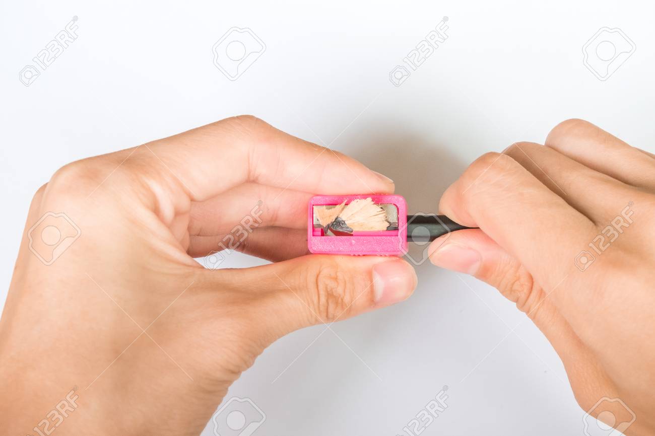 手の白い背景の上の鉛筆 削り を削る の写真素材 画像素材 Image