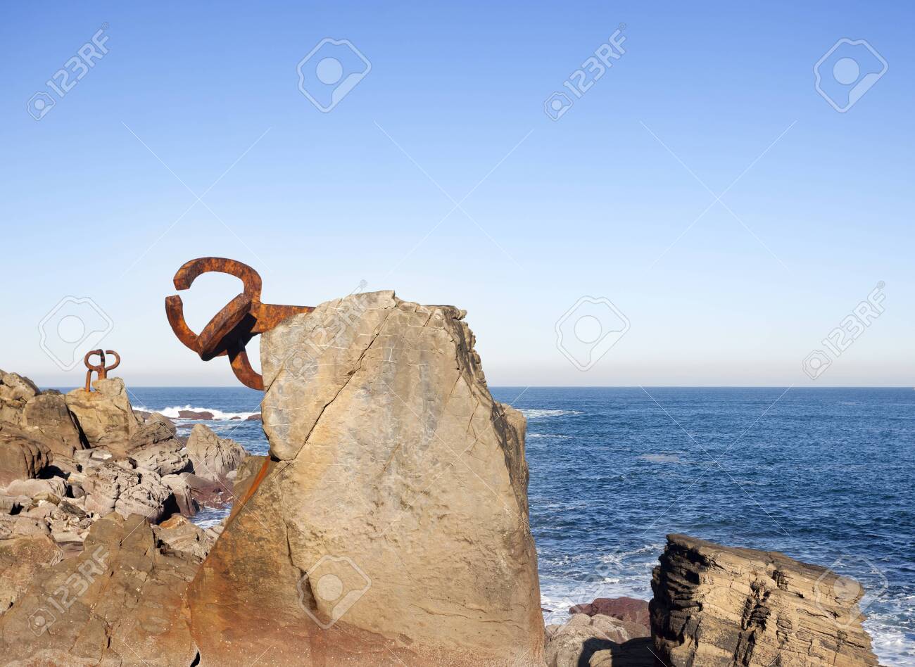 Donosti, Spain-December 22, 2014: On sunny days,in the end of the la Concha beach you can see Chillida's sculptures - 121836733 Donosti, Spain-December 22, 2014: On sunny days,in the end of the la Concha beach you can see Chillida's sculptures - 121836733