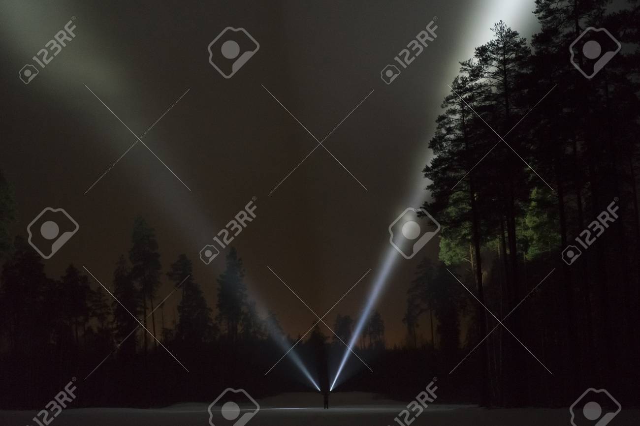 Man Standing Outdoor At Night In Forest Shining With Two Flashlights Stock Photo Picture And Royalty Free Image Image