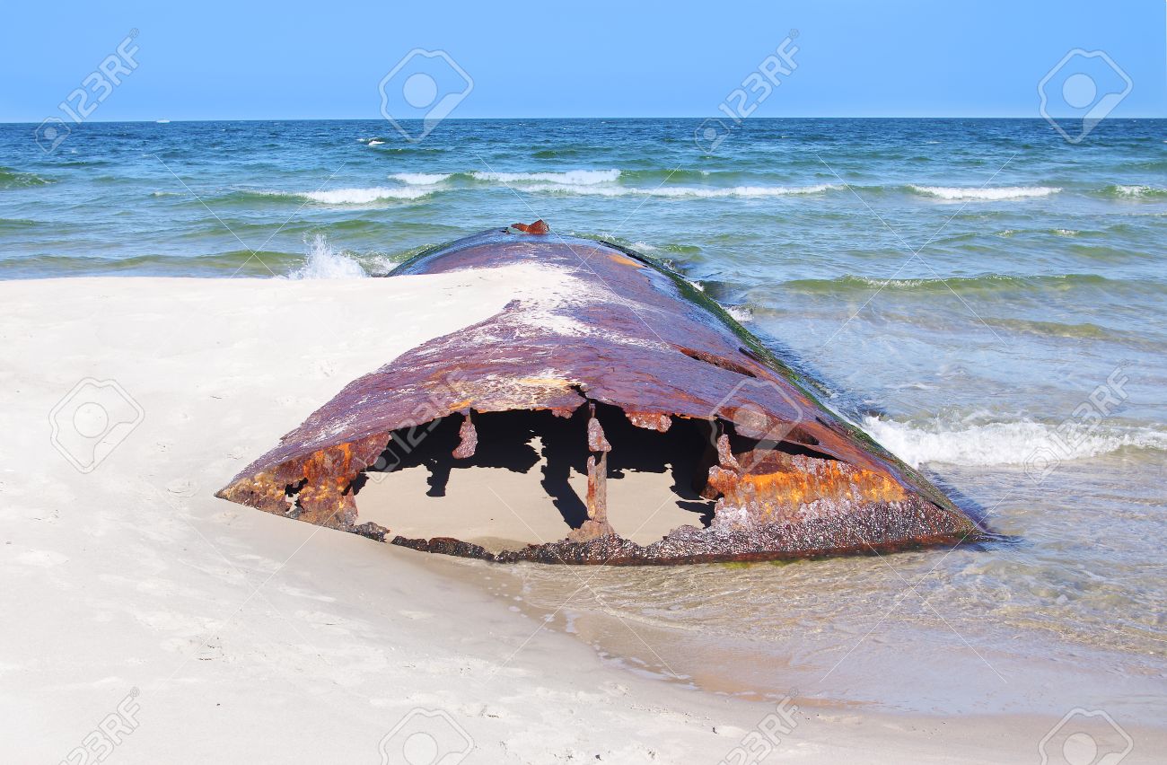corroded iron tank on the baltic beach hel poland stock photo