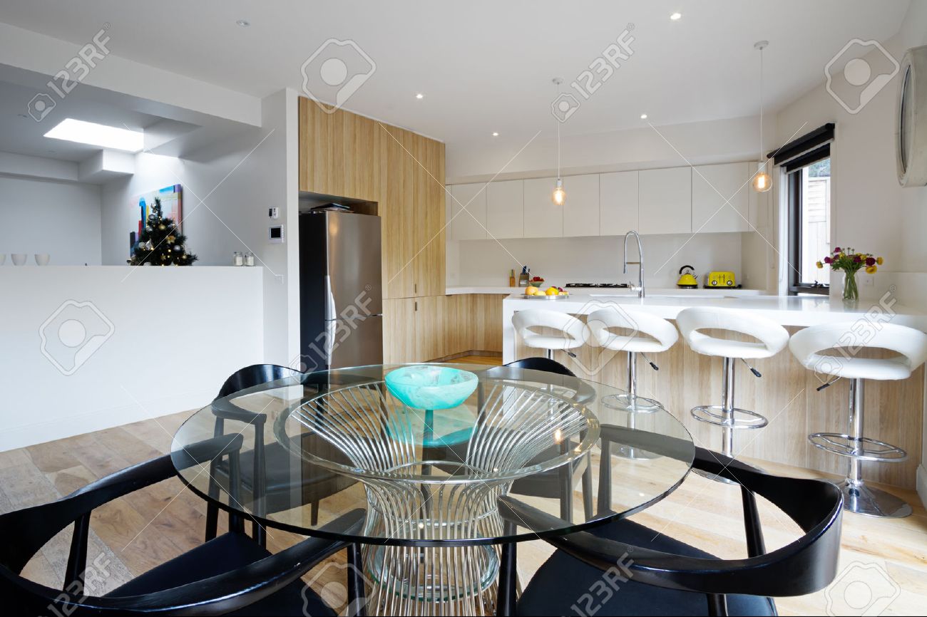 Kitchen With Island Bench And Open Plan Dining Area In Modern Kitchen With Island Bench And Open Plan Dining Area In Modern Australian Home Stock Photo