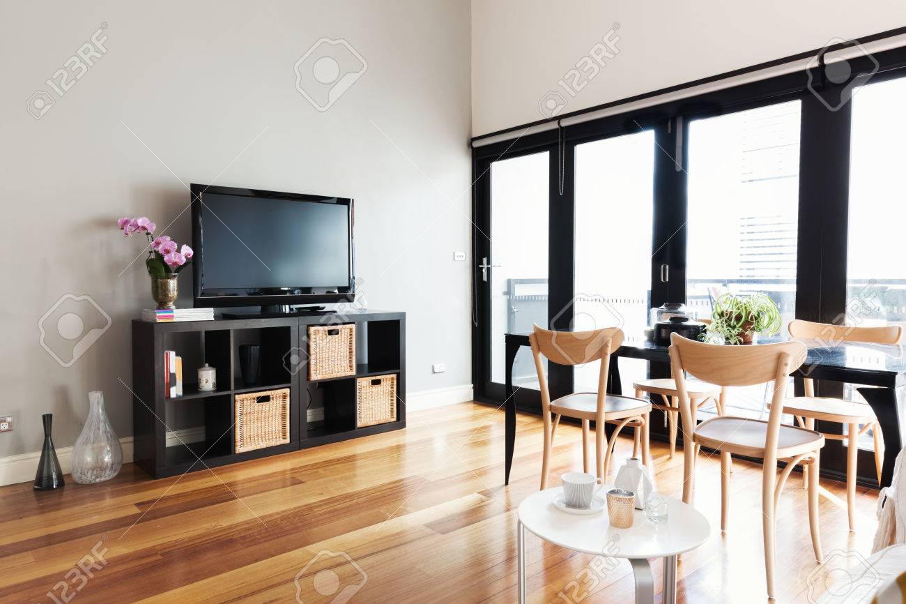 apartment living room with tv comfy modern apartment living room with tv on buffet and bi fold door to balcony stock photo apartment living room with tv on buffet and bi fold door apartment living room with tv comfy modern apartment living room with tv on buffet and bi fold door to balcony stock photo apartment living room with tv on buffet and bi fold door