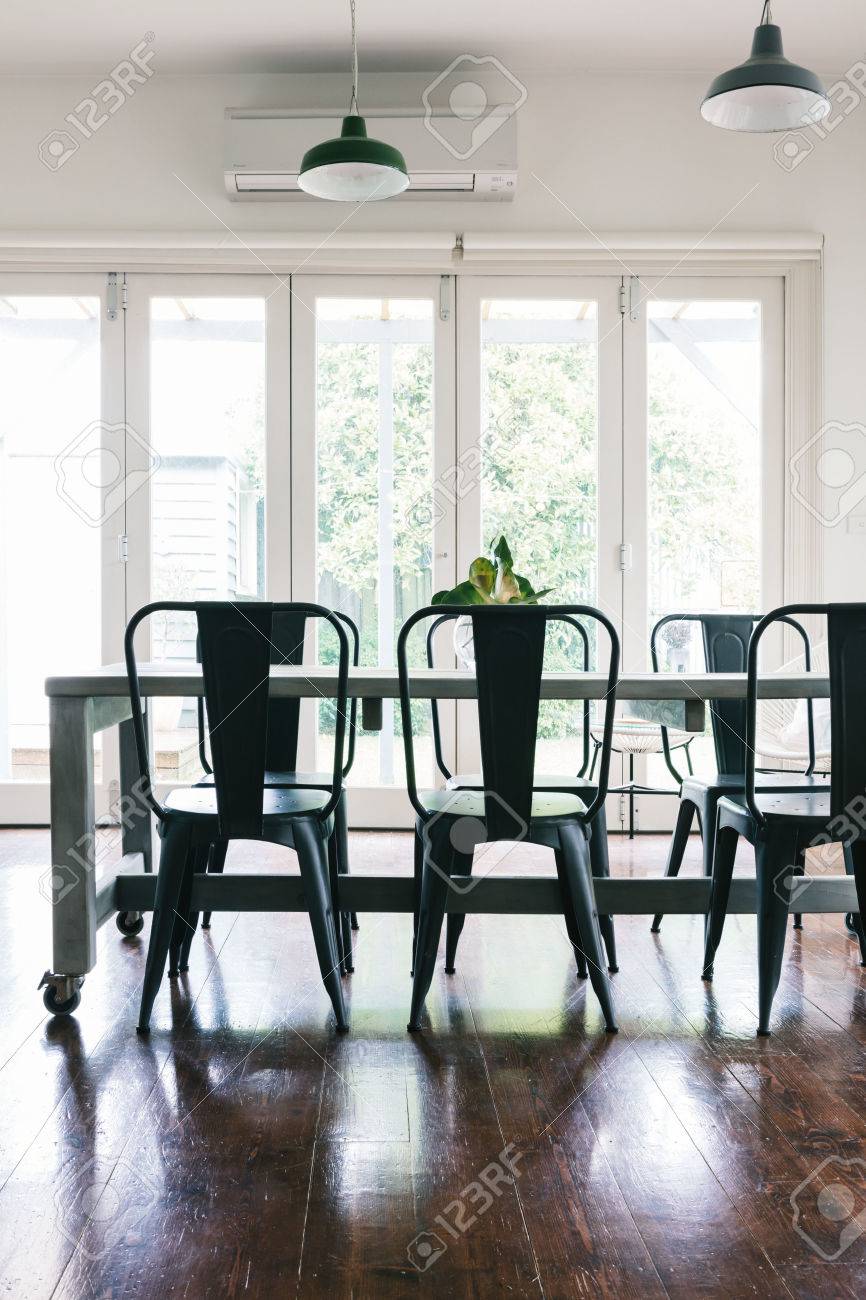 Contemporary Vintage Styled Light Bright Dining Room With Bifold Doors Vertical Stock Photo Contemporary Vintage Styled Light Bright Dining Room With Bifold Doors Vertical Stock Photo