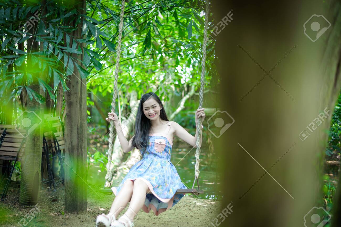 Asian Pretty Girl Has Relaxing With Swing At Little Tree Garden Cafe Nakhon Pathom Province Thailand In The Morning Stock Photo Picture And Royalty Free Image Image