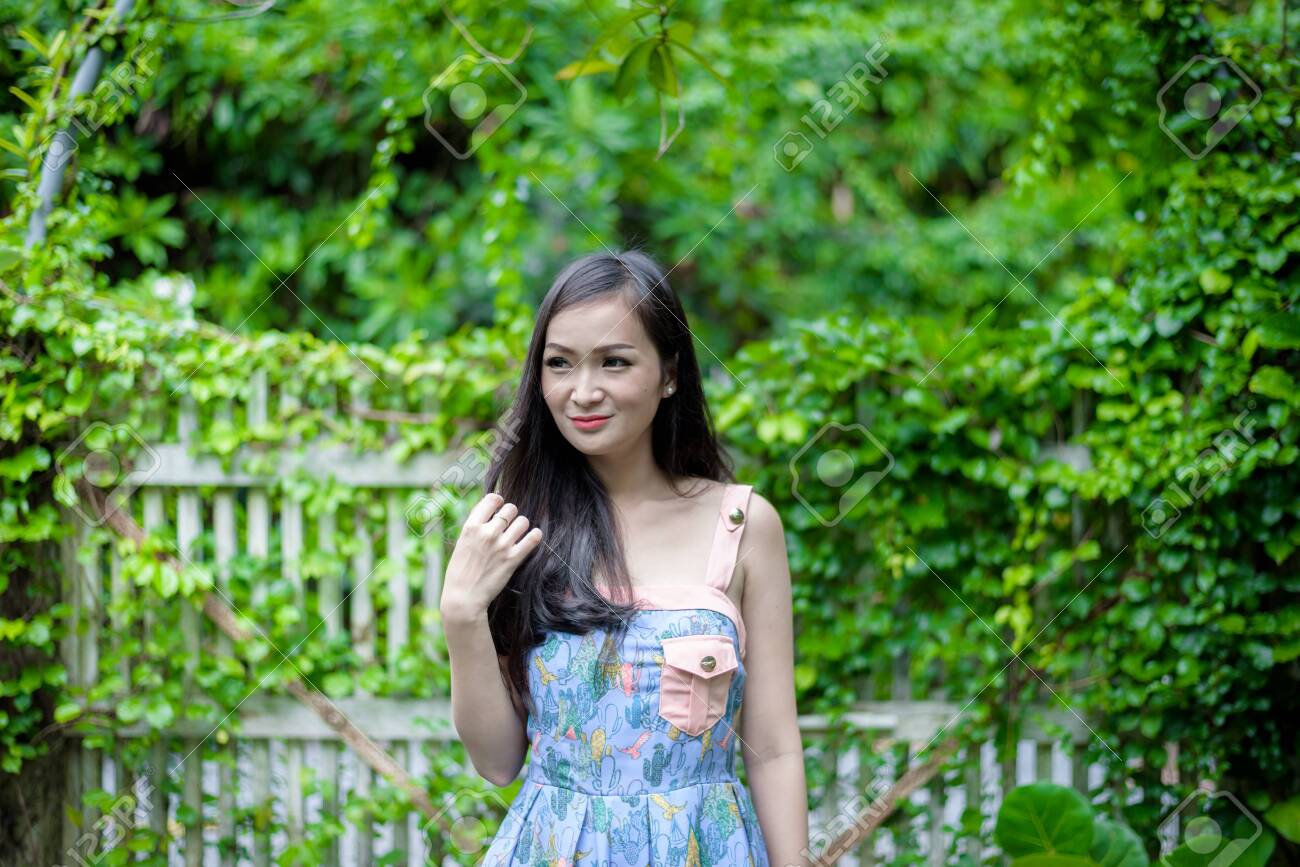 Asian Pretty Girl Has Relaxing With Happy And Smiling At Little Tree Garden Cafe Nakhon Pathom Province Thailand In The Morning Stock Photo Picture And Royalty Free Image Image