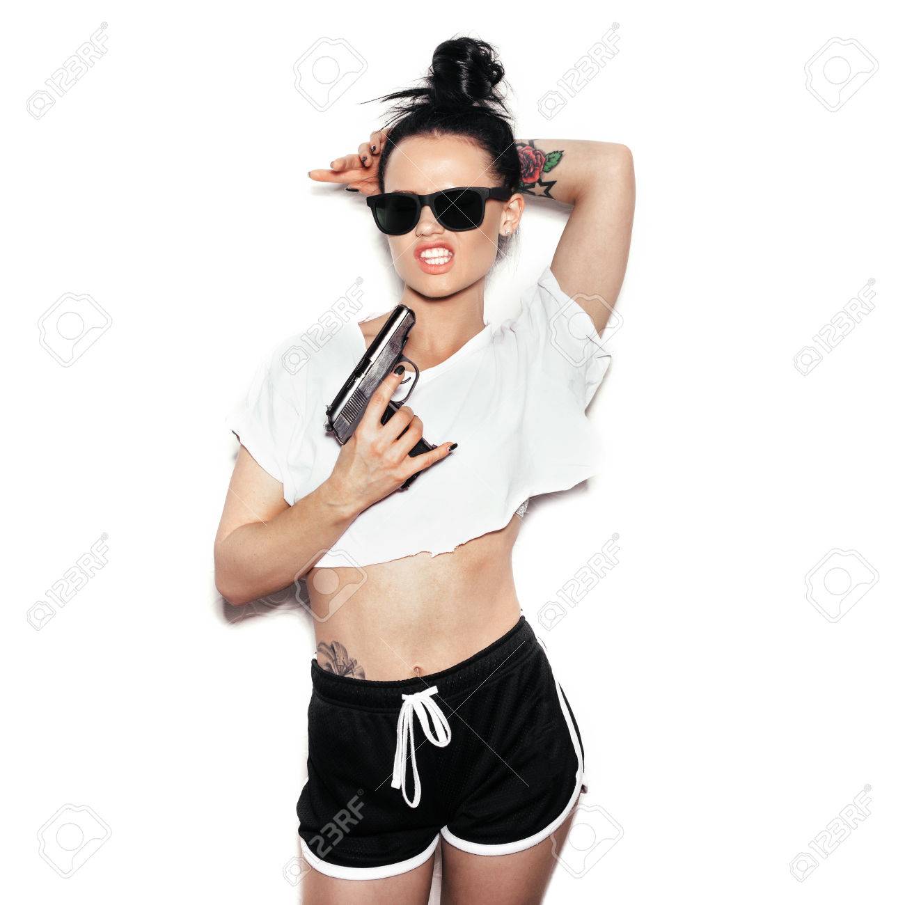 Stock Photo , Stylish fashion swag girl with gun.