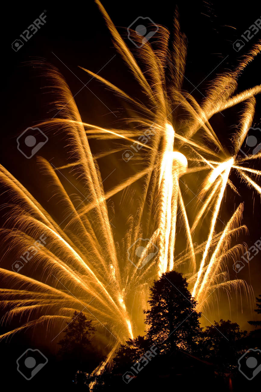 explosive fireworks shooting into the sky lighting up the night