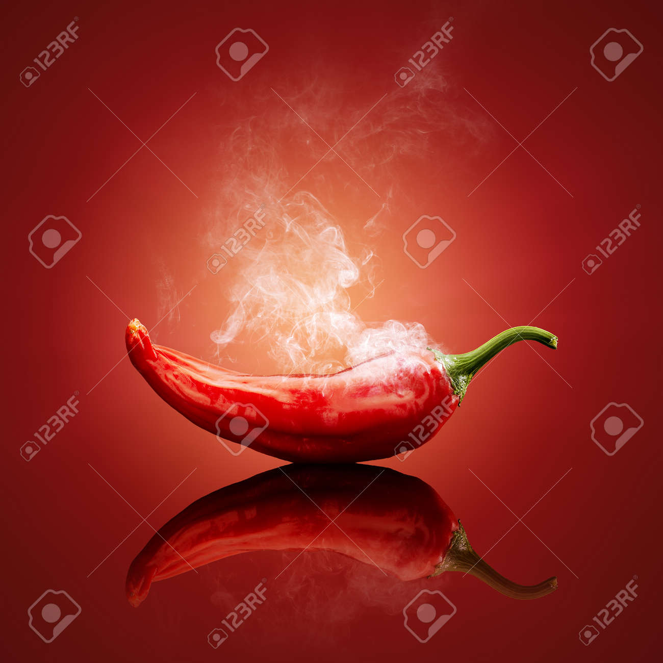 Hot chili red smoking or steaming with reflection - 39988067 Hot chili red smoking or steaming with reflection - 39988067