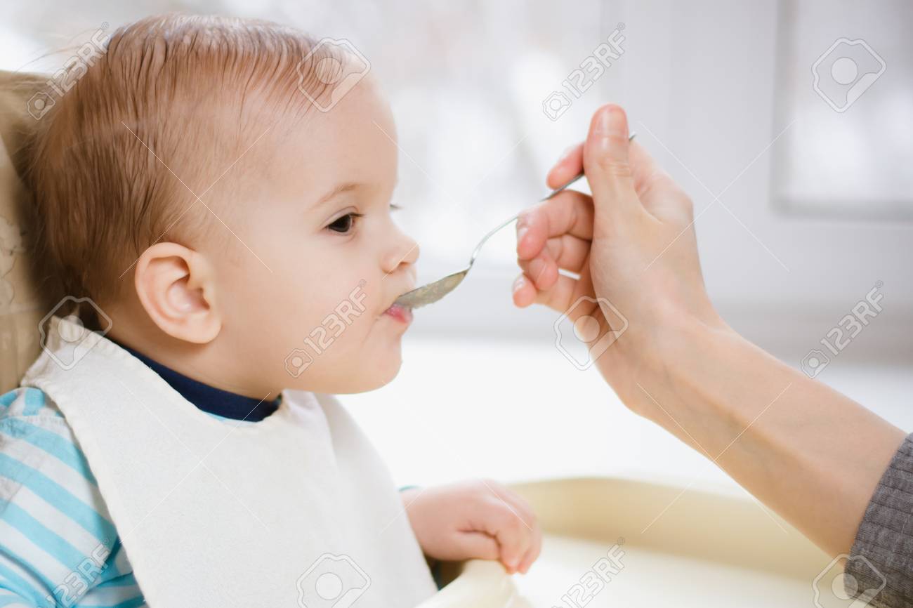 baby eating porridge